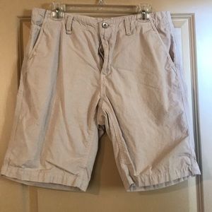 Tan shorts, very light material.